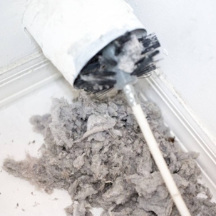 dirty dryer vent getting cleaned