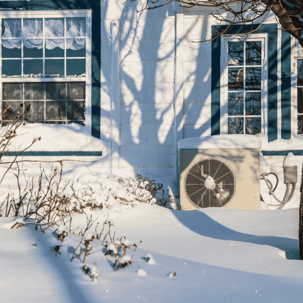 home covered in snow with a new furnace
