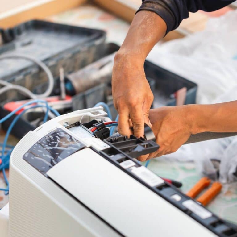 Technician working on hvac unit