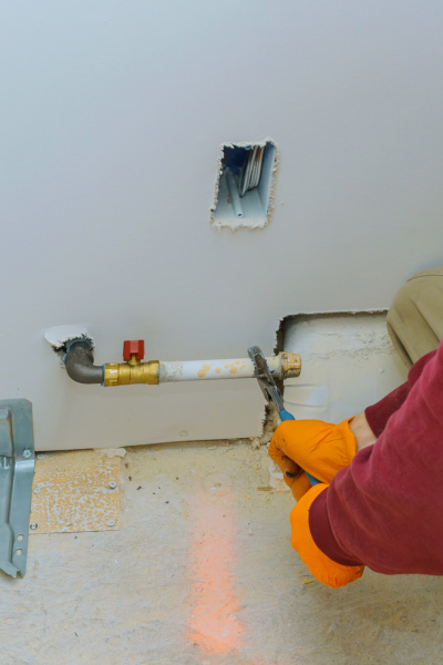 technician working on gas line