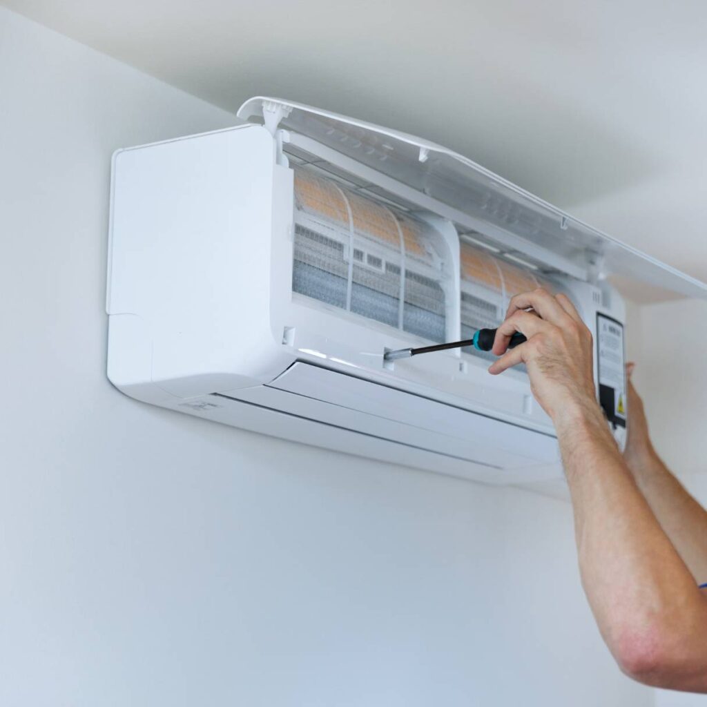 thomas hvac employee performing an hvac installation service in a residential home