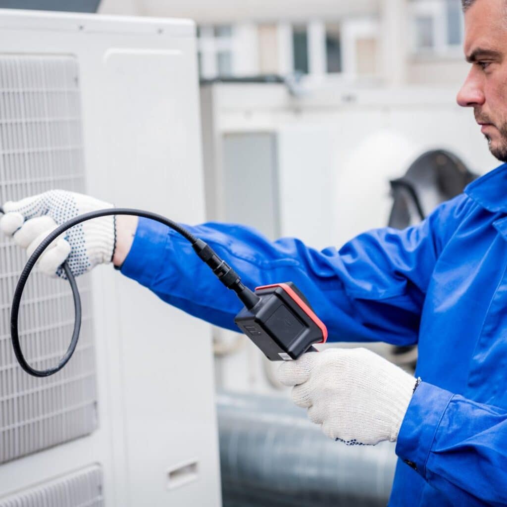 thomas hvac employee performing an evaporator replacement service for a customer