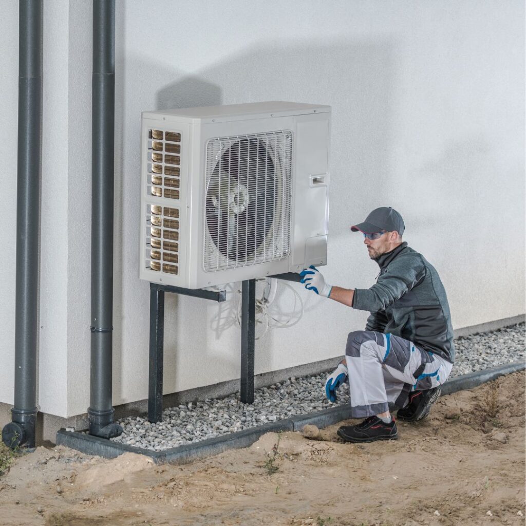 thomas service company employee installing a new heat pump at a alabama home in huntsville