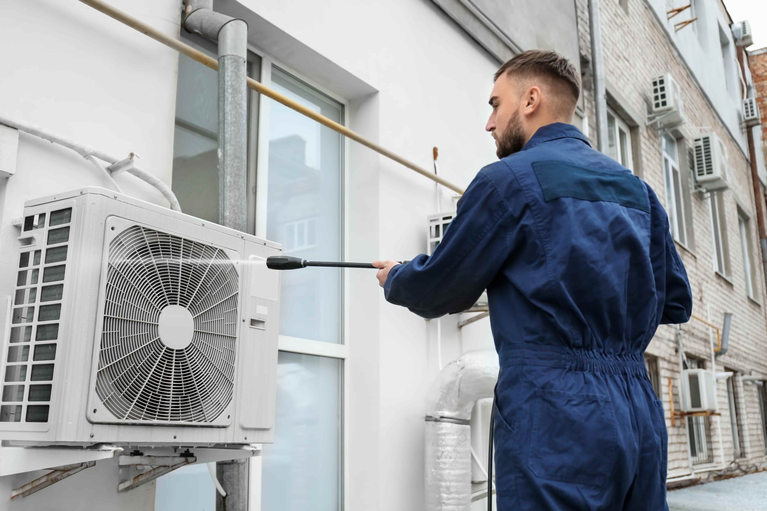 hvac professional working on hvac and air ducts