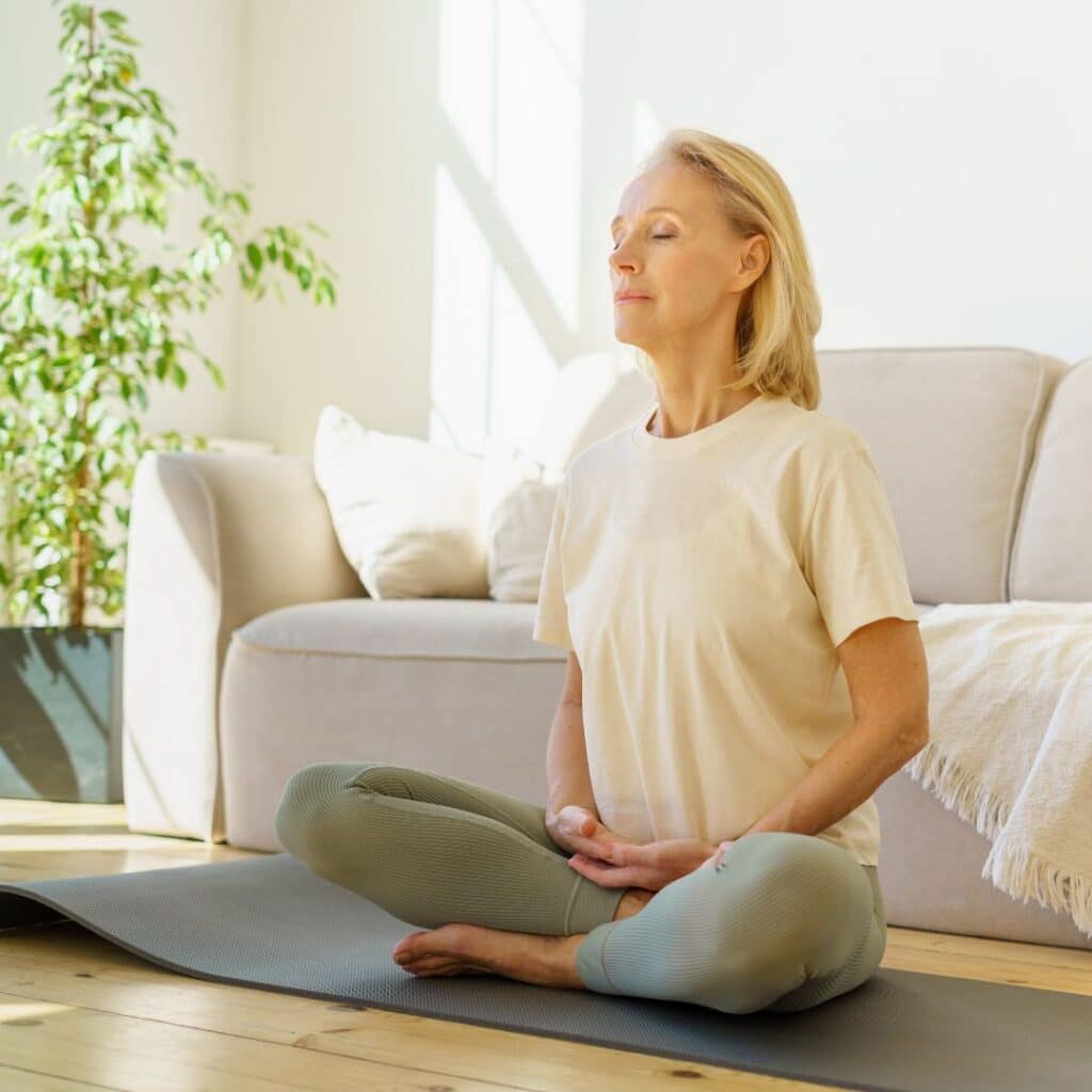 woman in her home breathing clean air after getting the most out of her air duct cleaning services