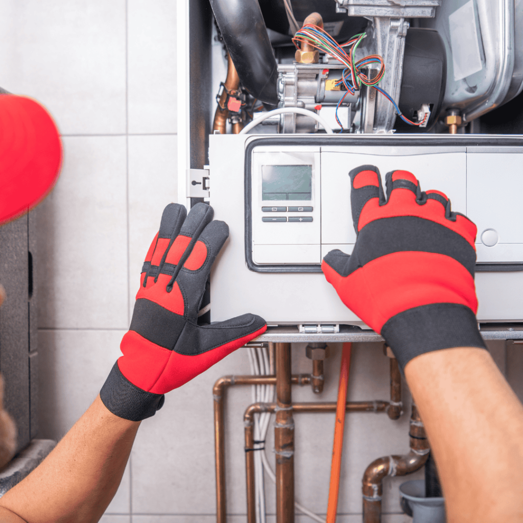 thomas hvac technician performing a furnace tune up 