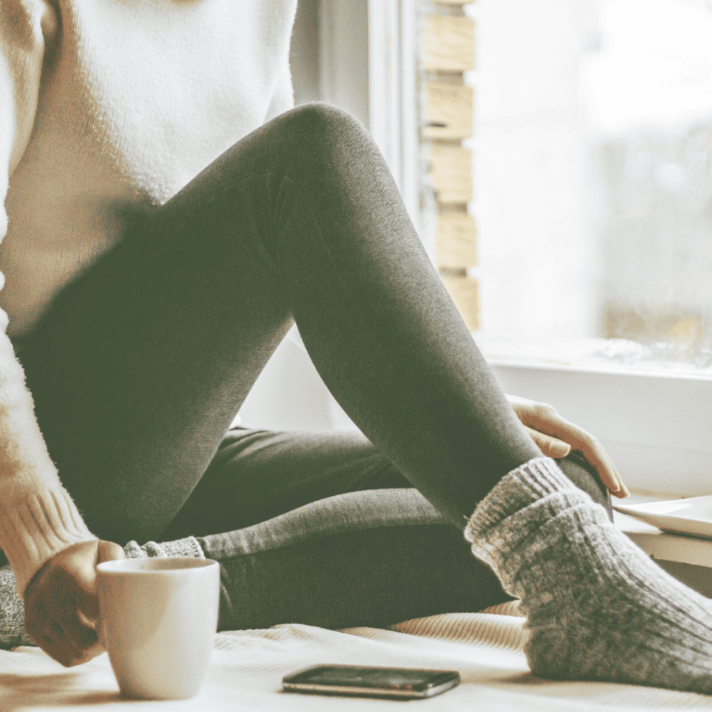 woman staying warm and cozy indoors