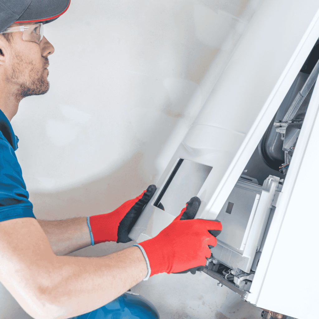 thomas hvac employee working on an hvac system that is not blowing hot air