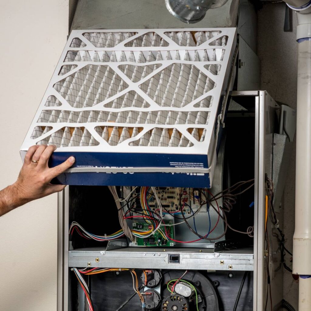 filter being changed by thomas hvac professional