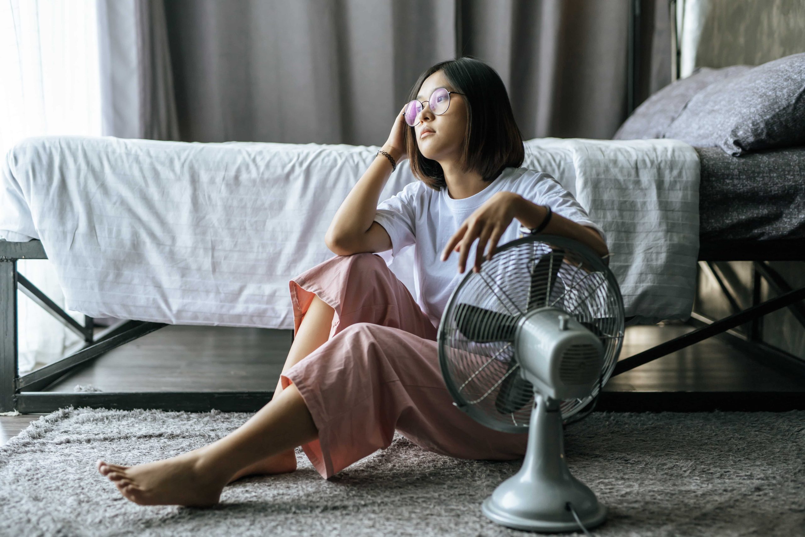 woman reading about how to choose a new hvac system