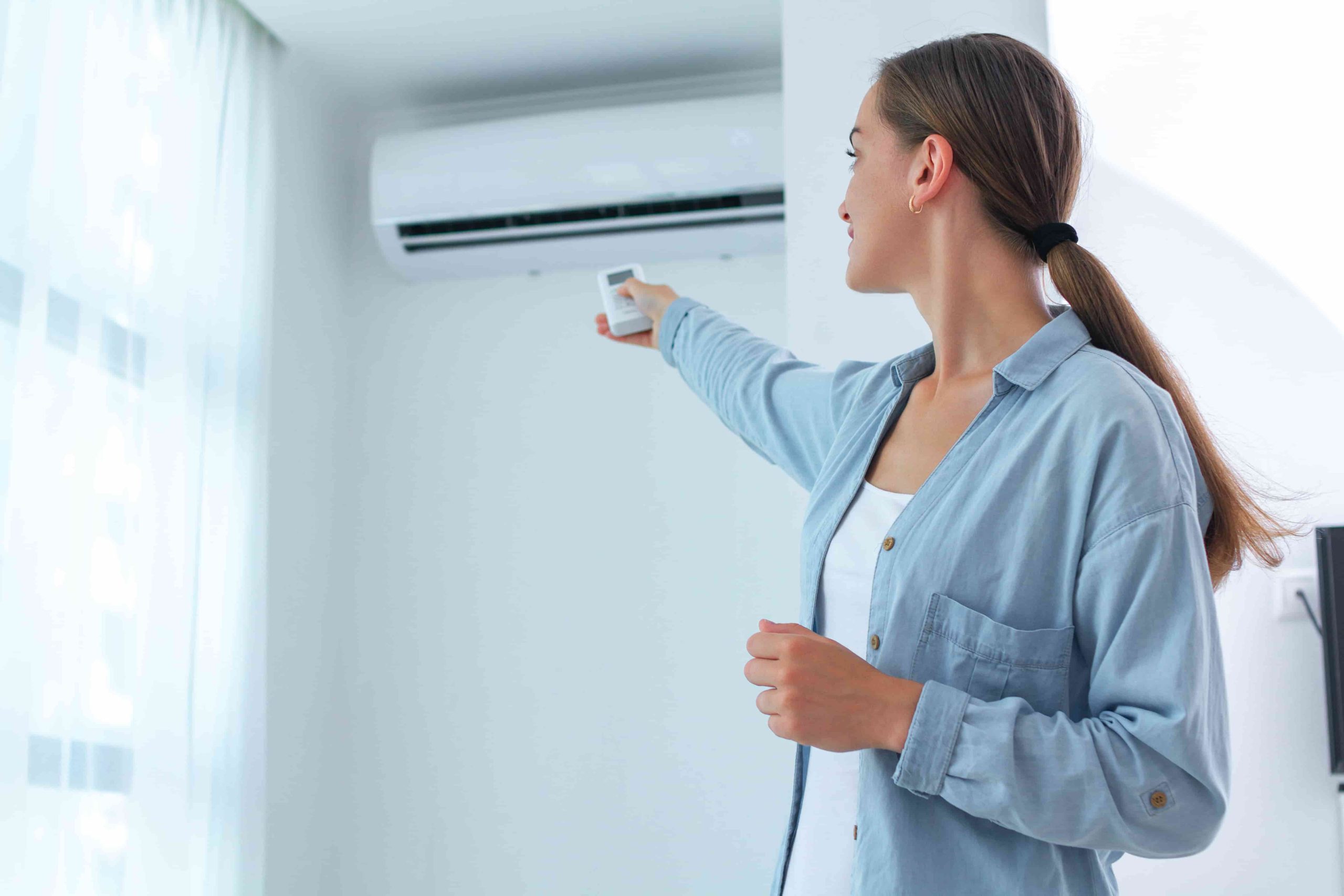 woman using ac unit