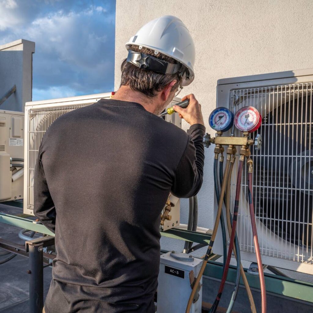 thomas hvac employee installing a mini split system